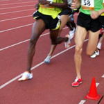 Runners on athletic track