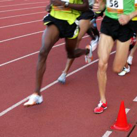 Runners on athletic track